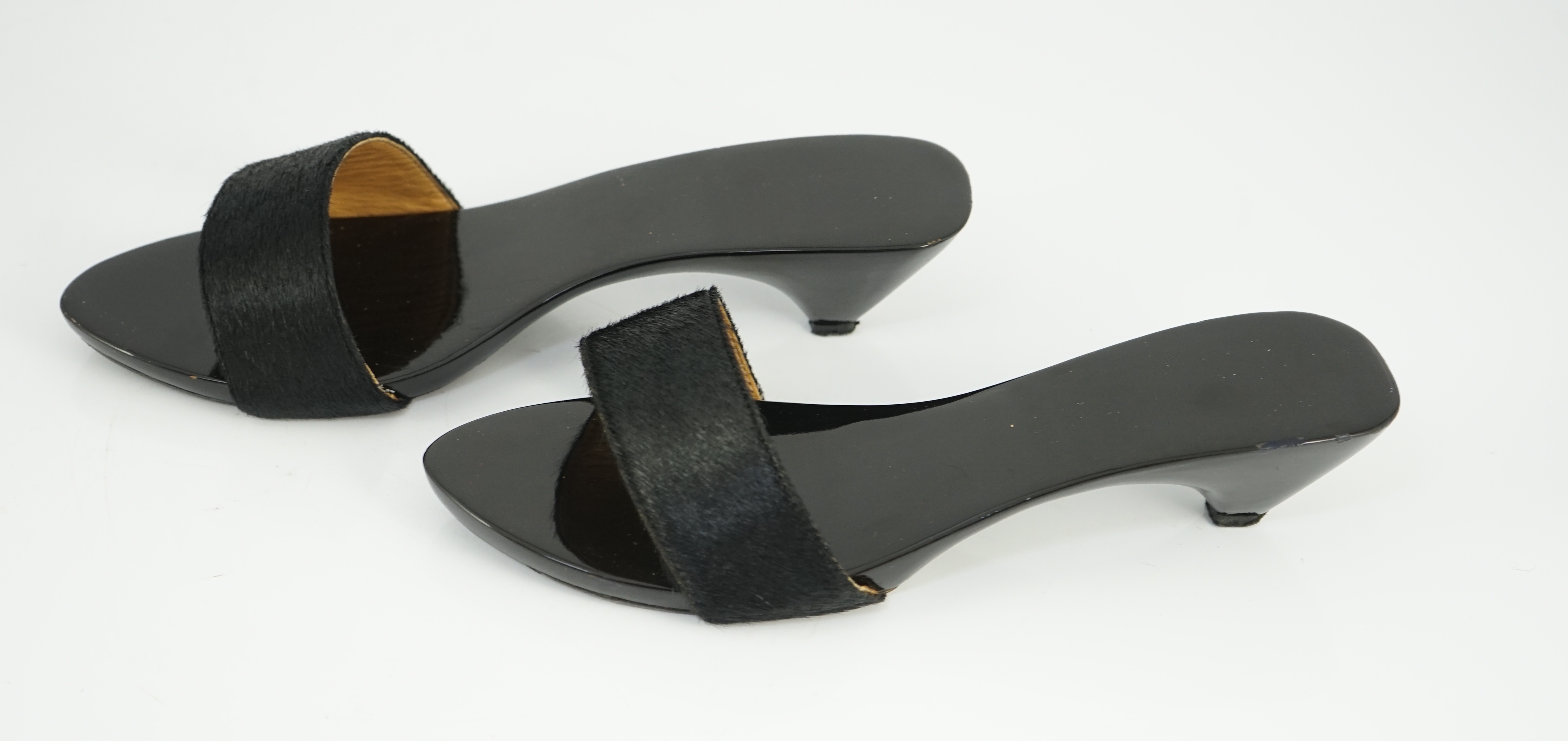A pair of Hermès black pony skin and lacquer mules, Size 39